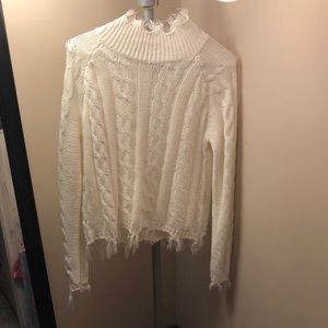 Size large, white cropped fringed sweater.